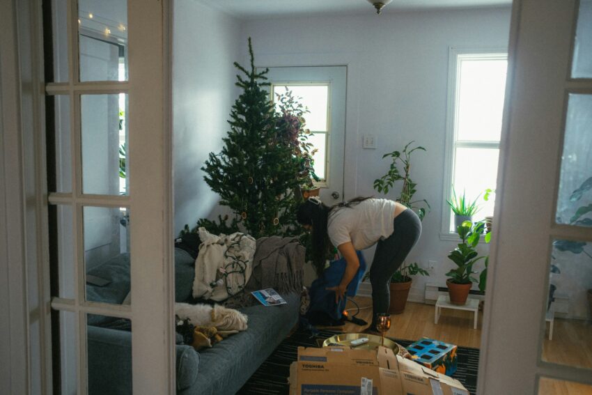a woman cleaning the mess in the house