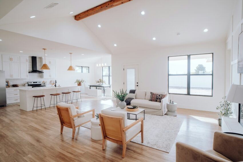 a clean living room, dining room and kitchen